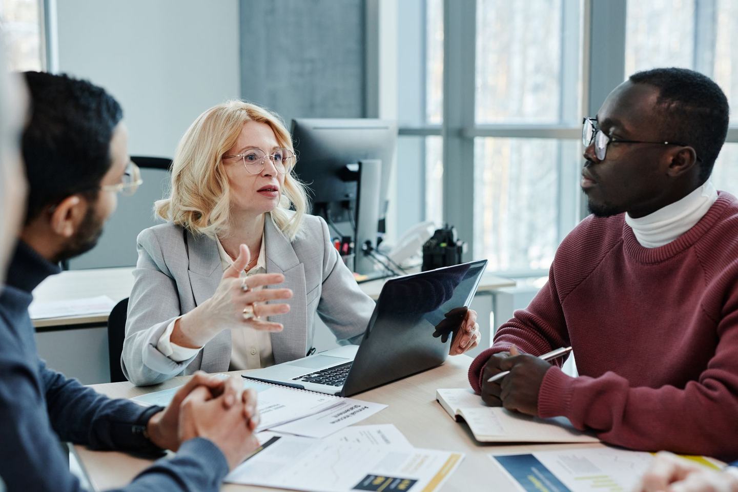 A manager and employee in a one-on-one review discussion at a small table